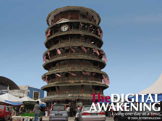 Photoshopped image of the Leaning Tower of Teluk Intan with a blue sky background